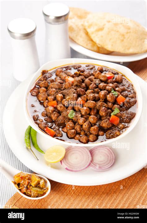 Chana masala with puri , indian food Stock Photo - Alamy