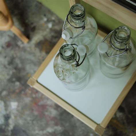 Premium Photo High Angle View Of Empty Glass Bottles On Table