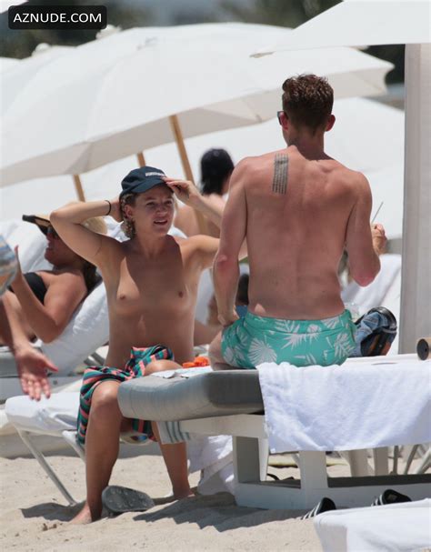 GG Magree Goes Topless With Red Bikini Bottoms At The Beach In Miami