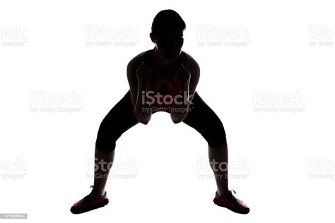 Silhouette Of Sporty Woman Squats Sumo Stock Photo Download Image Now