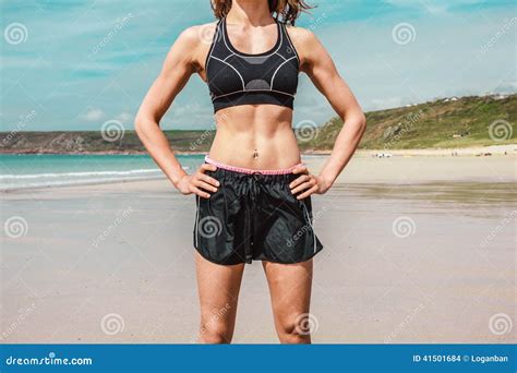 fit young woman  toned abs  beach stock photo image
