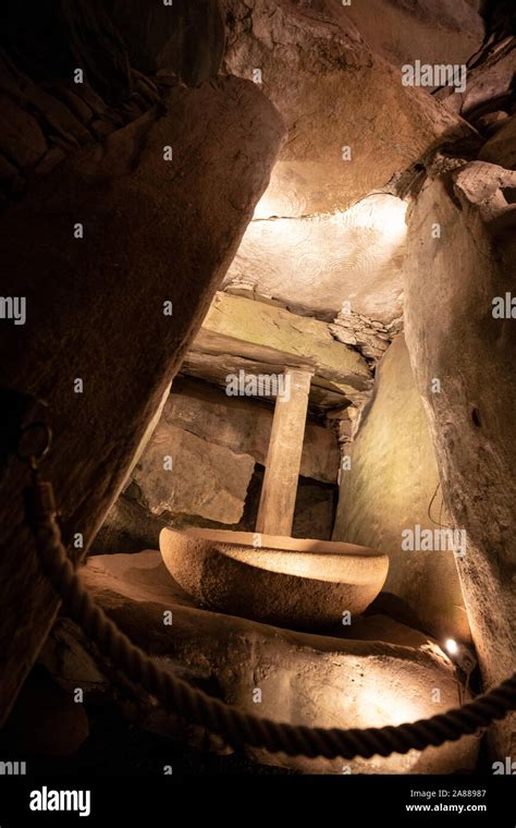 Interior of Newgrange megalithic burial mound and standing stones ...