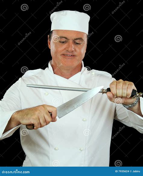 Man Sharpening A Chef`s Knife With Damascus Steel Stock Photo ...