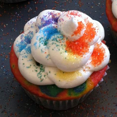 Rainbow Sprinkles Arranged On Rainbow Cupcake With White Buttercream Icing Rainbow Cupcakes