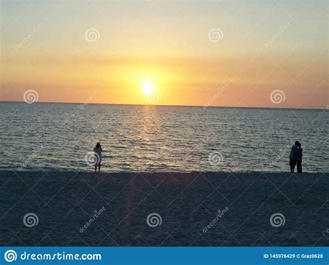 People Watching Sunset On The Beach Stock Image Image Of Coast