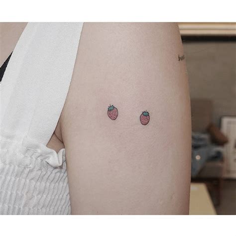 Tiny Minimalistic Strawberries Tattooed On The Upper