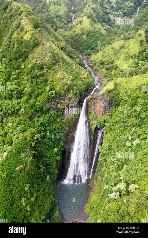 Aerial View Of The Manawaiopuna Falls Also Known As The Jurassic Falls In The Moutains In Kauai