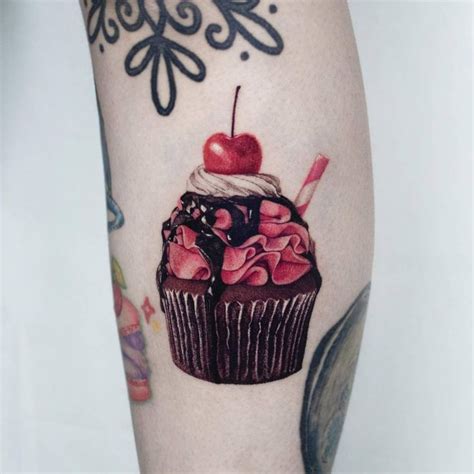 Micro Realistic Style Cupcake Tattoo Located On The Cupcake Tattoos