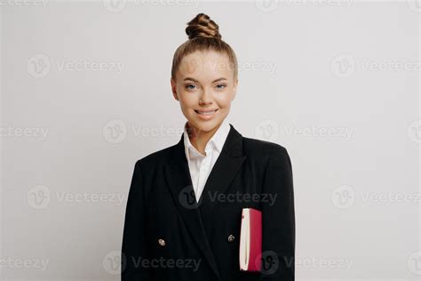 Female boss in dark suit with notebook expressing success 13085294 ...