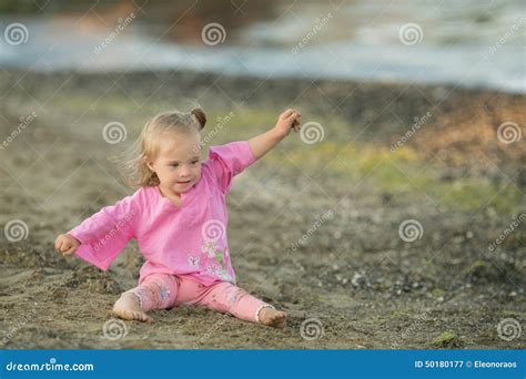 Beautiful Girl with Down Syndrome Shows How a Bird Flies on the Beach ...