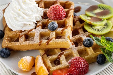 Belgium Waffles With Ice Cream Caramel Sauce And Fresh Berries Stock