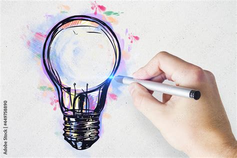 Hand drawing creative light bulb sketch on concrete wall background ...