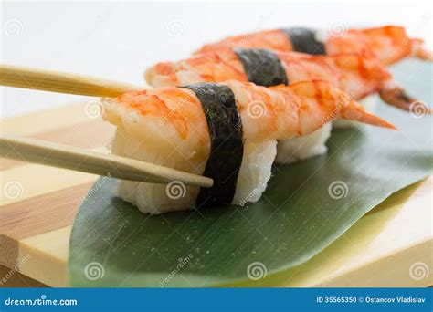 Shrimp Sushi Nigiri On Wooden Plate Isolated On White Background Stock