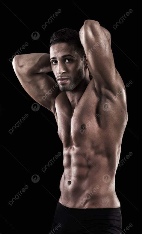 Homem Musculoso Em Um Fundo Preto Físico Masculino Abs Foto E Imagem