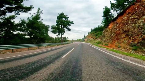 First-person footage of road trip along mountain pass. captures road ...