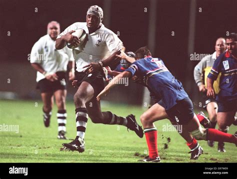 Apenisa Naevo Of Fiji Bursts Through The Namibia Defence Hi Res Stock