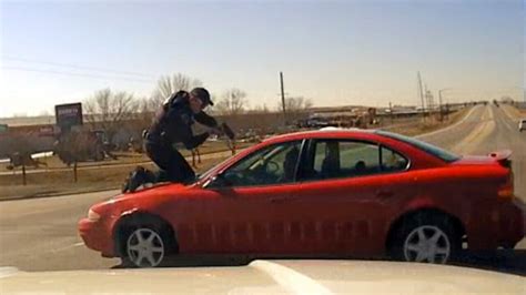 Video Shows Driver Fleeing Iowa Police With Officer On Hood Roof Of