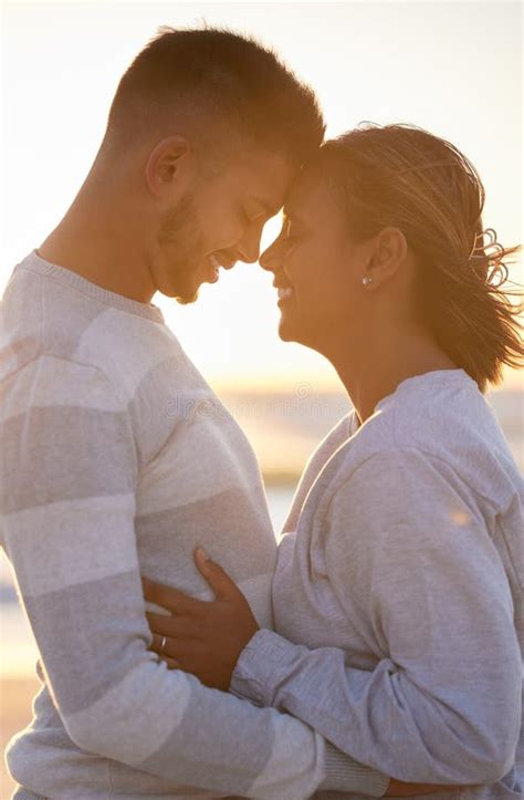 Couple Sunset And Forehead Touch For Love Outdoor Beach Date And