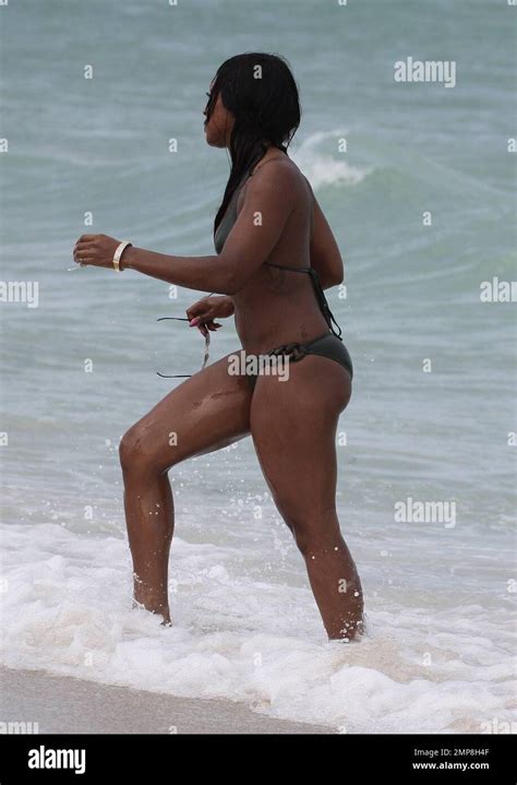 Alexandra Burke Shows Off Her Bikini Clad Body In A Military Green Two Piece As She Takes A Dip