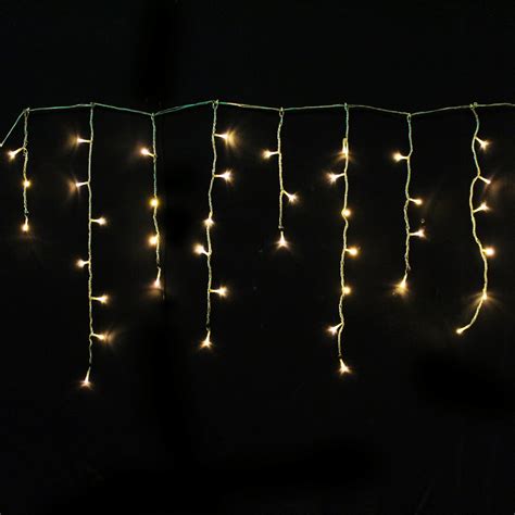 M L Warm White Led Icicle Fairy Lights On Clear Cable