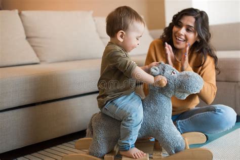 Baby Playing with a Rocking Horse Stock Image - Image of young ...