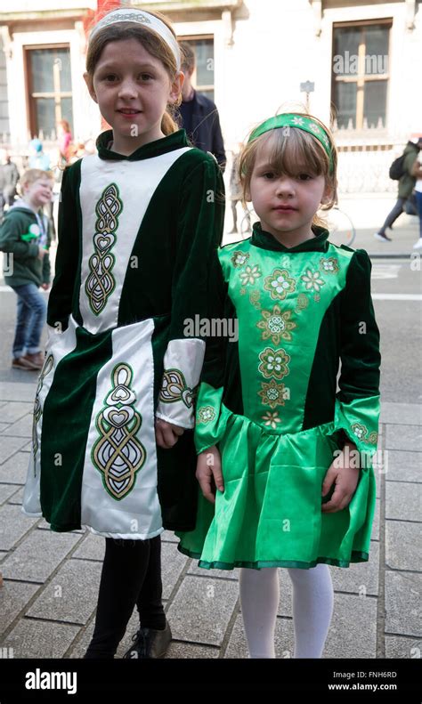 Two Young Girls Dressed In Traditional Irish Costume Attend The St