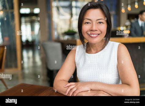 Happy Elegant Asian Middle Aged Businesswoman Smiling Portrait