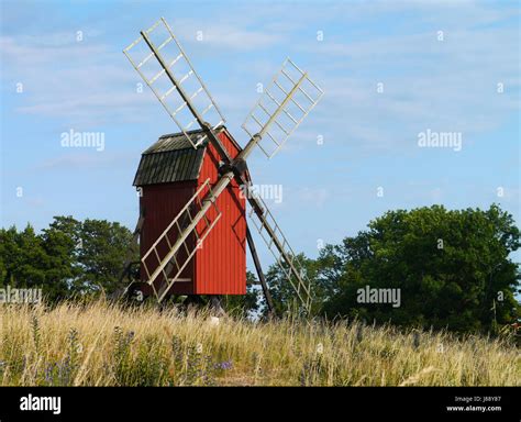 windmill on land Stock Photo - Alamy