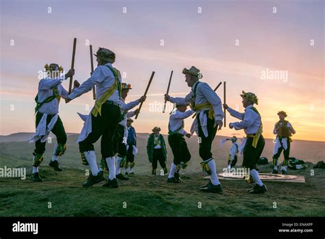 Morris dancers from the Chapel-en-le-Frith Morris Men dance at sunrise ...