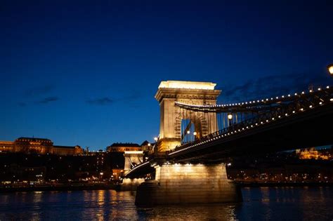 Premium Photo | Bridge over river at night