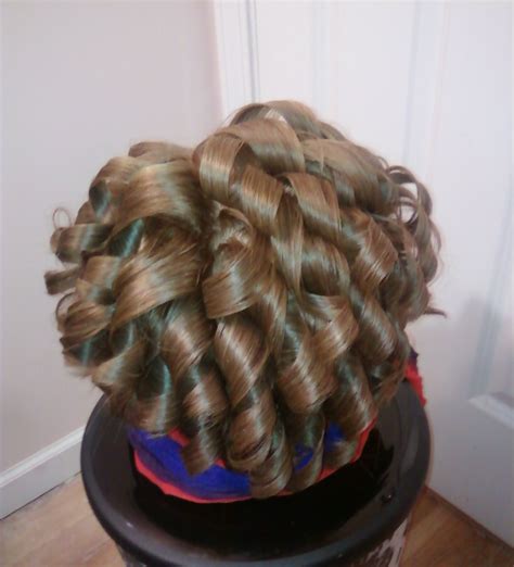 Crazy spiral "banana curls" on short hair. This was to set the hair for a large fingerwave look ...