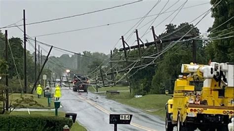 SEE IT: Severe storm in Virginia sends 25 power poles crashing into street near school