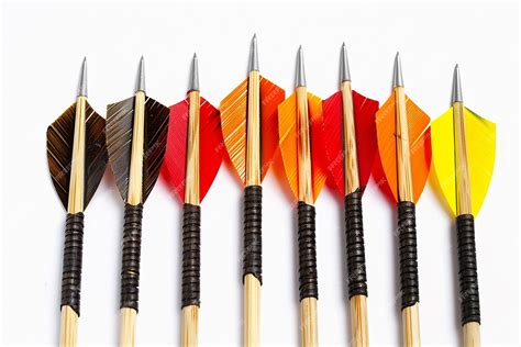 Premium Photo A Line Of Darts With A Red And Orange Arrow Pointing To