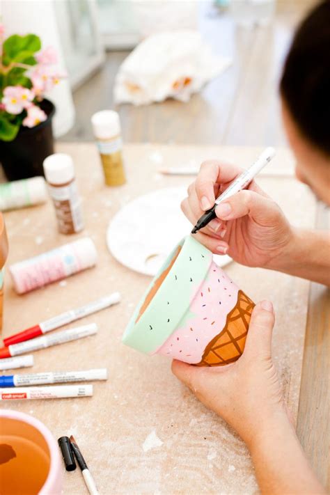 A Woman Is Painting An Ice Cream Cone