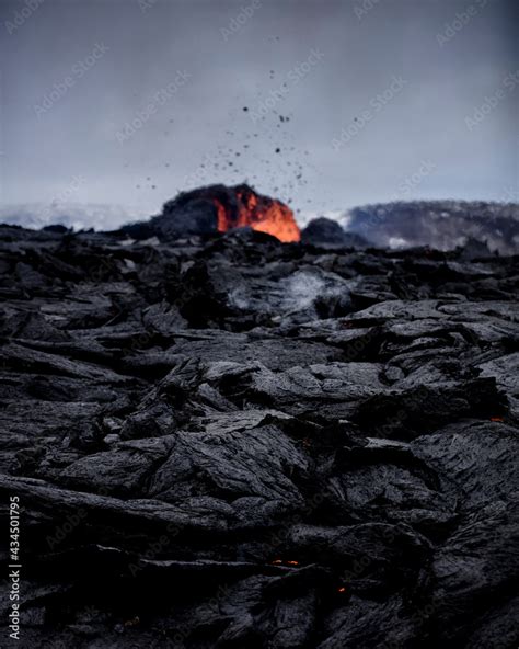 View Of A Crater And Fresh Lava Flowing From Volcano Eruption In