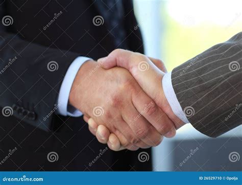 Business People Shaking Hands Over A Deal Stock Photo Image Of