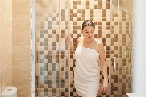 Mature Woman Stepping Out Of A Shower By Stocksy Contributor Ivan