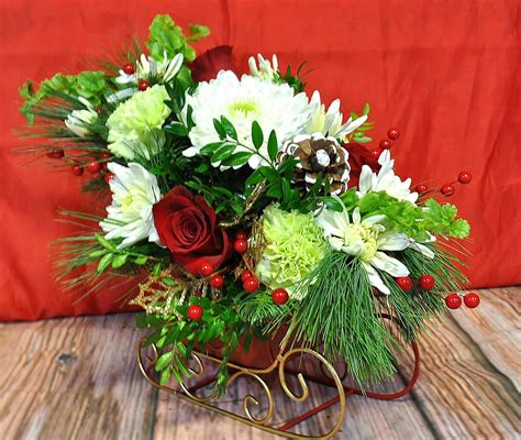 Fresh Flowers Beautifully And Creatively Arranged In Holiday Containers