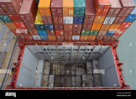 Containers, cargo bay, container ship Stock Photo - Alamy