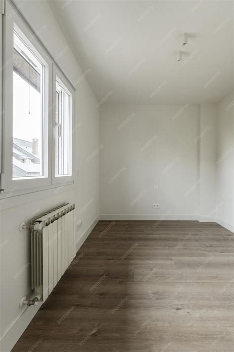 Premium Photo | A recently renovated empty room with white painted