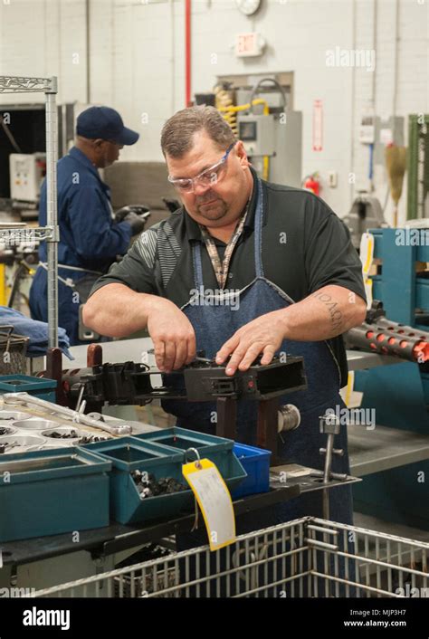 Christopher Cotten Installs The Retracting Slide On A M A Machine Gun