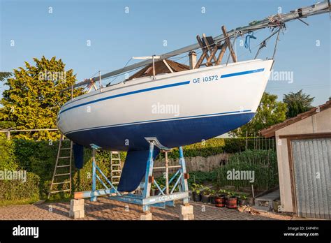 A Sailing Yacht In A Cradle In A Boatyard After Being Painted With