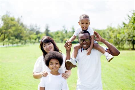 Happy Diverse and Mixed Race Family Group Photo in the Park Stock Photo ...