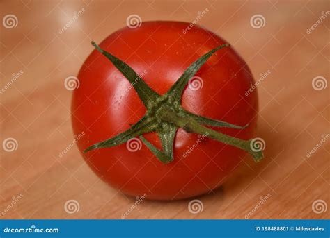 Single Tomato Laying On Its Side Stock Image Image Of Worksurface