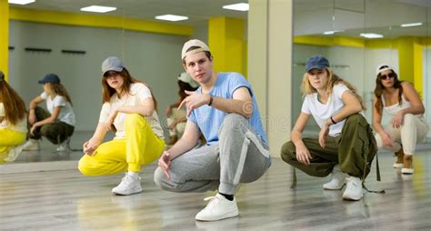 Group Of Young Cool Active Dancers Training Together During Dance