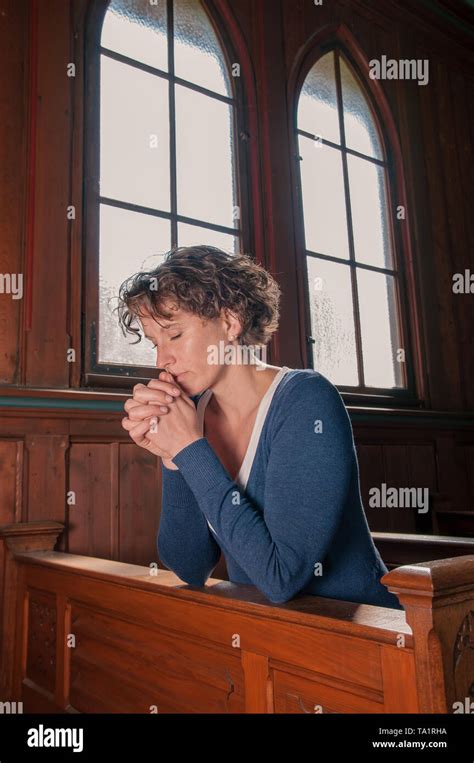 Girl Kneeling Praying In Church Hi Res Stock Photography And Images Alamy