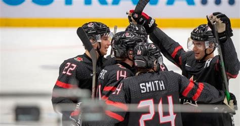 Lethbridge Hurricanes players gather to watch teammates face off at ...