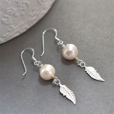 Sterling Silver Pearl And Feather Dangly Earrings By Martha Jackson