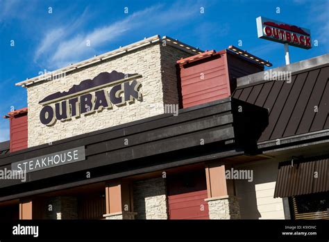 A Logo Sign Outside Of A Outback Steakhouse Restaurant Location In Hagerstown Maryland On