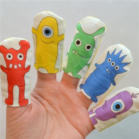 Monster Finger Puppets Printed With Rainbow Colored Designs On